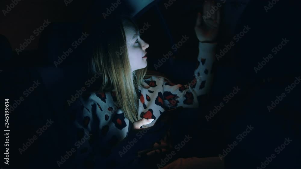 Young woman in the backseat of a car at night Young woman in the backseat of a car at night