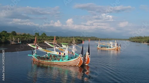 quadrocopter flying to large and beautiful Balinese boats in Prancak Perancak west bali photo