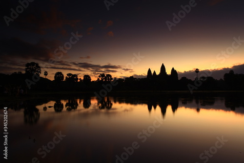 Sunrise view of popular tourist attraction ancient temple complex Angkor Wat with reflected in lake Siem Reap  Cambodia