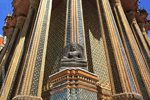 Black sitting Buddha made from volcanic lava rock In front of Royal Pantheon or Prasat Phra Thep Bidorn, Bangkok Thailand 