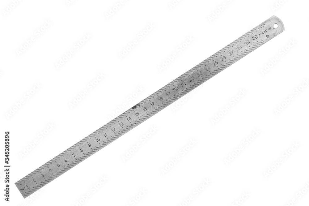 Old metal ruler isolated on white background. Measuring equipment