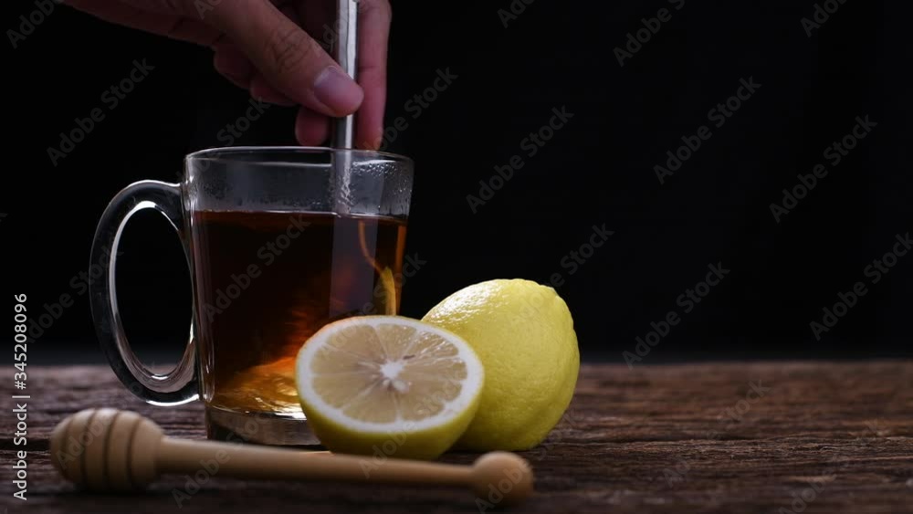 Hot honey lemon tea in glass Hot honey lemon tea in glass