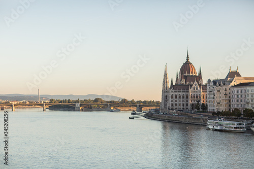 Hungarian Parliament building in the city of Budapest. Budapest at sunrise with clear blue sky. A sample of neo-gothic architecture, Budapest tourist attraction