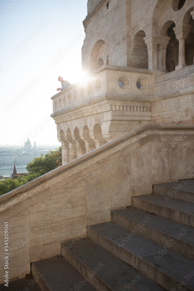 Fototapeta premium Budapest, Hungary - The famous Fisherman's Bastion at sunrise with statue of King Stephen I and Parliament of Hungary at background