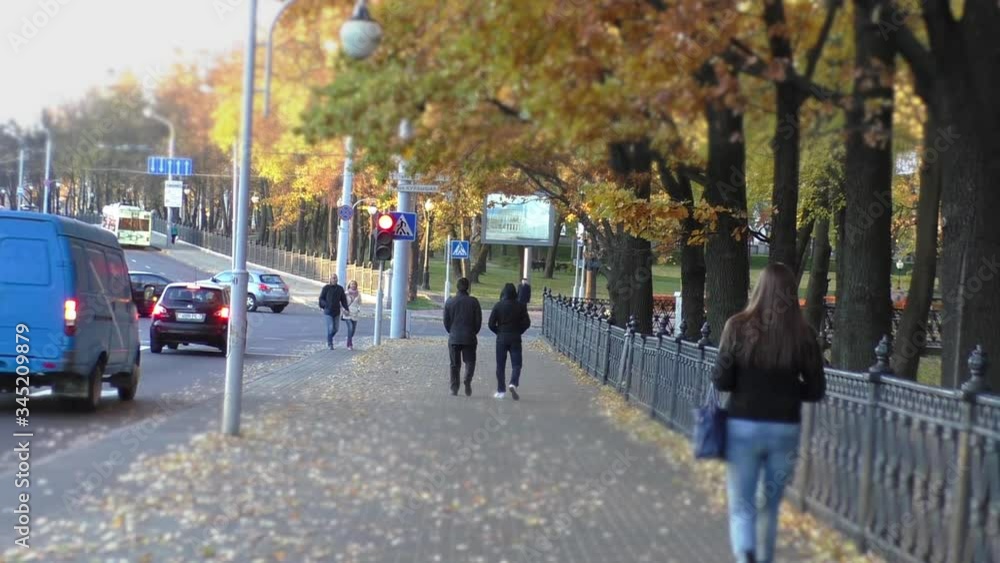 A person walking down the street A person walking down the street