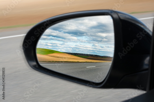 view of the outside car rearview mirror