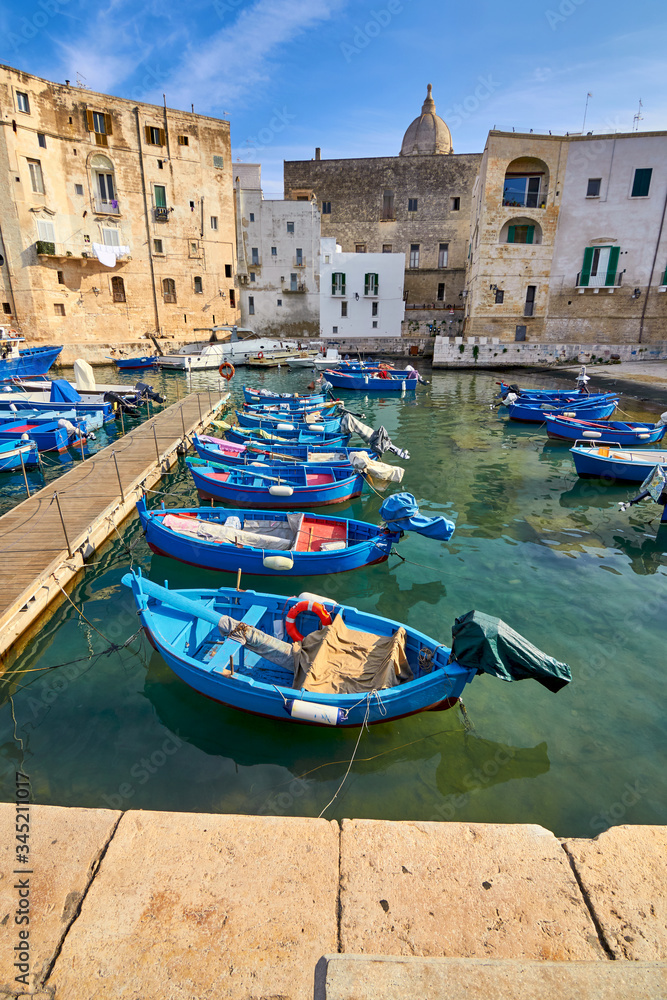 Old port of Monopoli province of Bari, region of Apulia, southern Italy. Boats in the marina of Monopoli