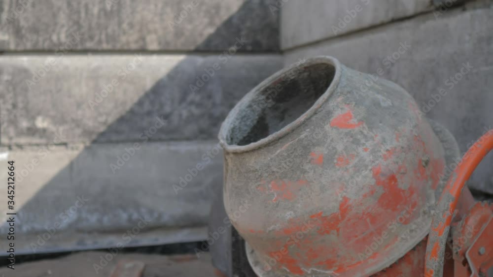 Industrial cement mixer machine a construction site. concept building constructing architect concrete pouring. lifestyle Mixes the sand, gravel and water Industrial cement mixer machine a construction site. concept building constructing architect concrete pouring. lifestyle Mixes the sand, gravel and water