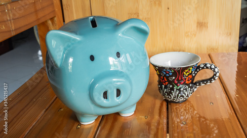 piggy bank isolated in wooden background, saving money is an investment for the future. Banking investment.