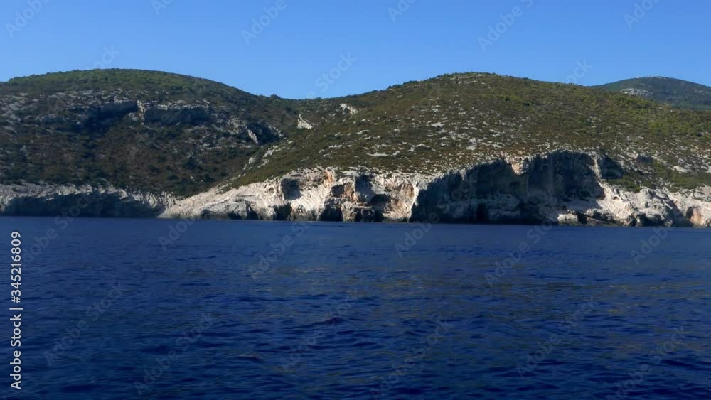 Tracking shot pov from a speed boat watching crystal clear turquoise sea waters and the rocky cliff island camera moves in the sea Tracking shot pov from a speed boat watching crystal clear turquoise sea waters and the rocky cliff island camera moves in the sea