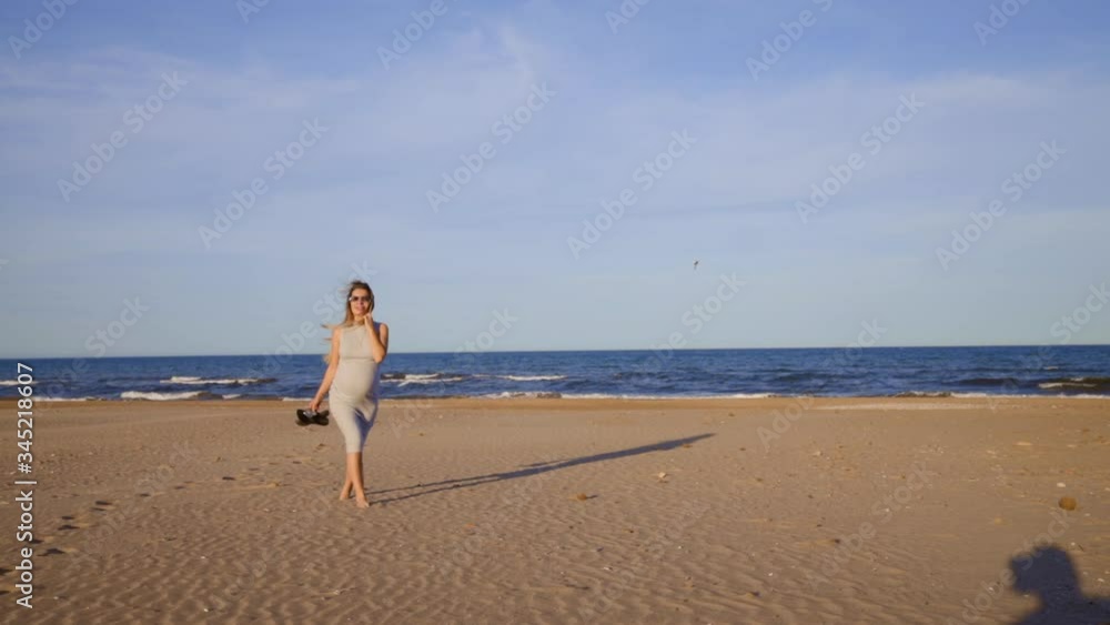 pregnant girl walking around shoreline in sunny day and good weather pregnant girl walking around shoreline in sunny day and good weather