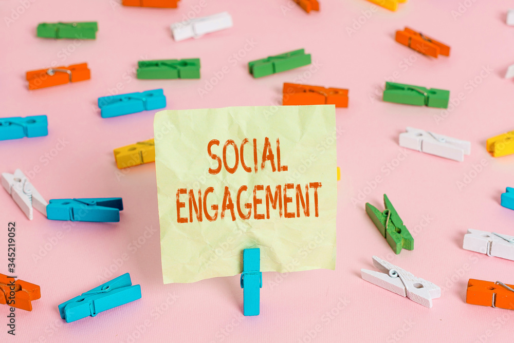 Conceptual hand writing showing Social Engagement. Concept meaning Degree of engagement in an online community or society Colored clothespin papers empty reminder pink floor office pin Conceptual hand writing showing Social Engagement. Concept meaning Degree of engagement in an online community or society Colored clothespin papers empty reminder pink floor office pin