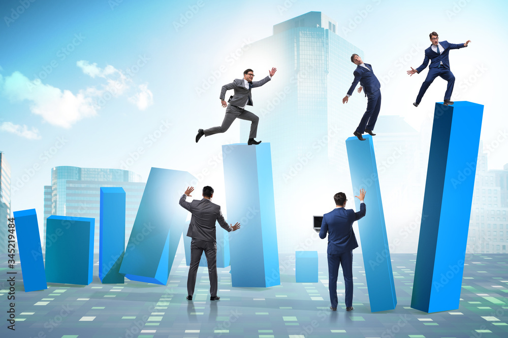 Business people in a collapsing economy concept Business people in a collapsing economy concept