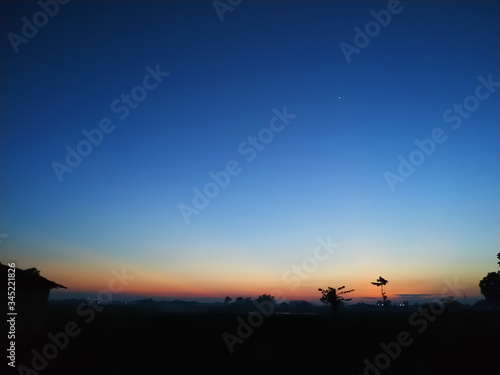 Fototapeta Naklejka Na Ścianę i Meble -  sunset in the mountains blue sky plant
