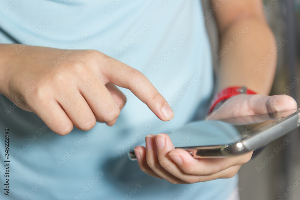 Close up of A man using mobile smart phone.
Close up of A man using mobile smart phone.