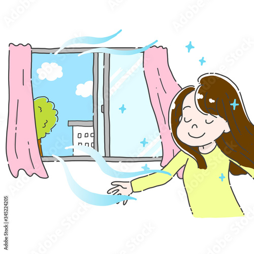 部屋の換気をする女性