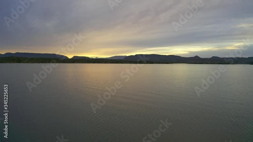 Wallpaper Mural Flying low over a lake during sunrise with mountains in the distance. Lake Pleasant, Arizona. Torontodigital.ca