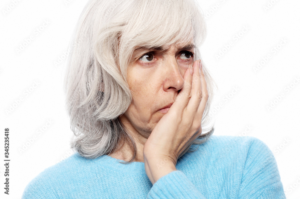 Elderly woman suffering from toothache on white background Elderly woman suffering from toothache on white background