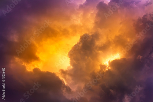 Bright orange in dark clouds and purple color sky