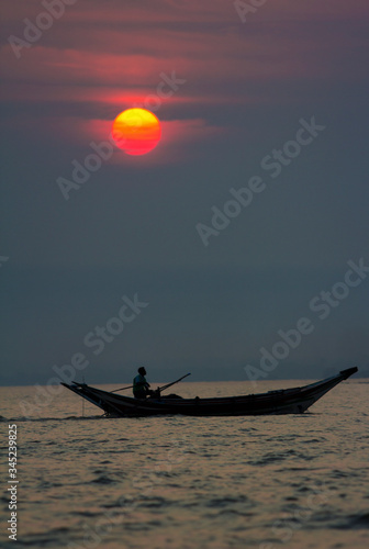 boat at sunset Burma