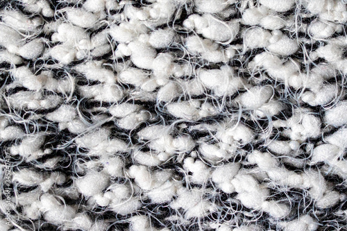 White and black thread wool, close-up.