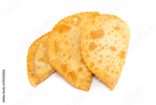 Juicy chebureki pies isolated on a white background.