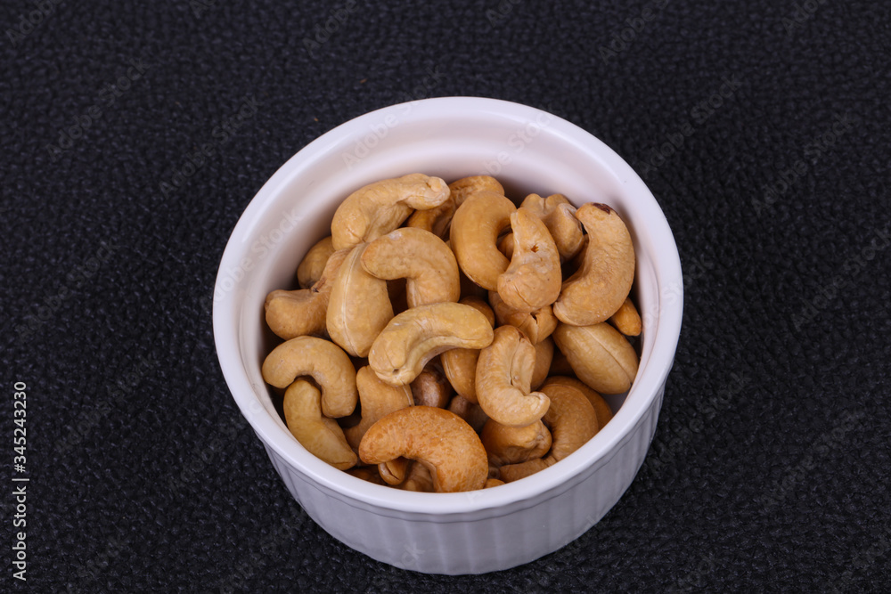 Cashew nuts heap in the bowl Cashew nuts heap in the bowl