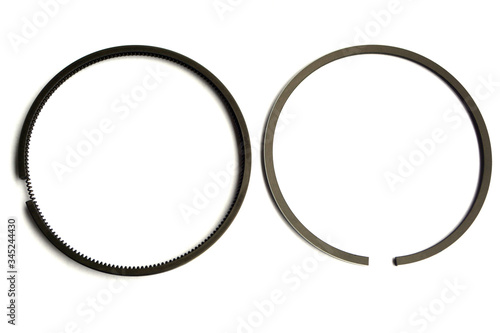 New car piston rings on isolated white background close-up.