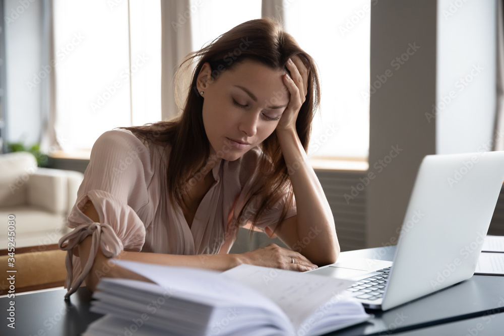 Tired sleepy woman sitting at desk with laptop, holding head, resting on  hand, sleeping at workplace, bored young female feeling drowsy, lazy and  unmotivated student, boring job, lack of sleep Stock Photo