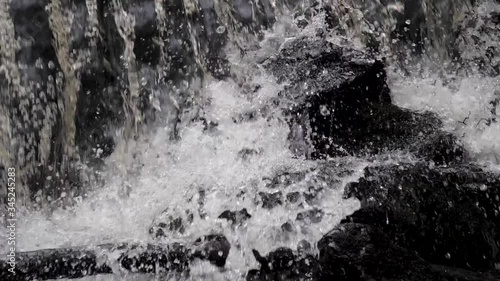 Wallpaper Mural water splash on stones in slow motion 180 fps Torontodigital.ca