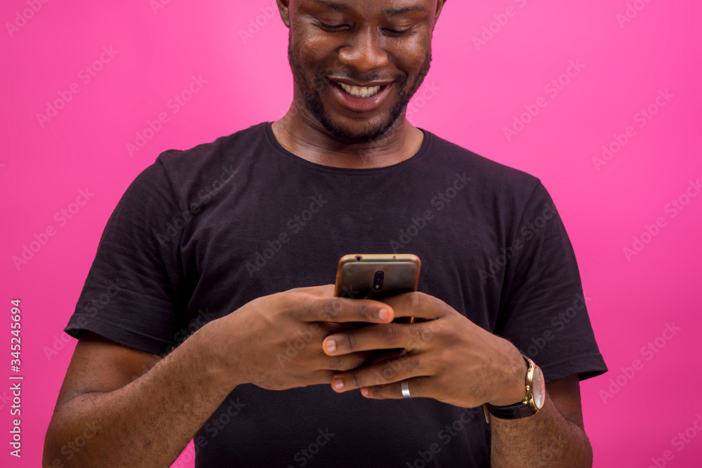 young black happy man using his smartphone to chat young black happy man using his smartphone to chat