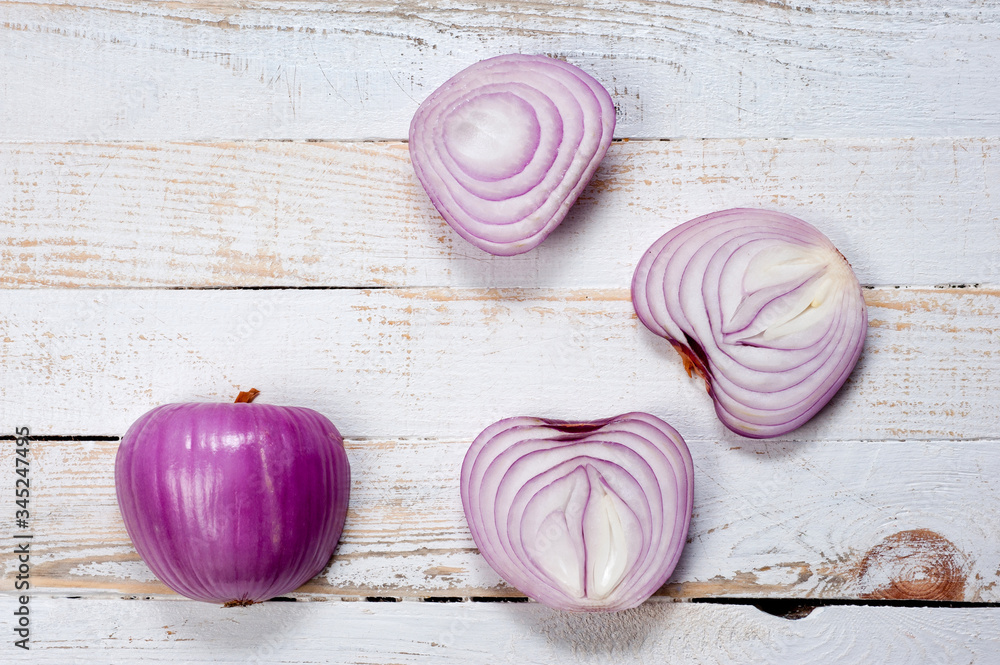 Red onion, lettuce. Health benefits, very rich in vitamins. Background for vegetables and garden plants and cooking. Red onion, lettuce. Health benefits, very rich in vitamins. Background for vegetables and garden plants and cooking.
