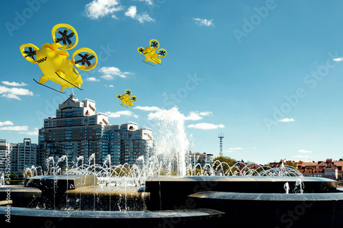 Yellow flying taxi against the sky, city electric transport drone. Car with propellers, clean air, fast ride. Mixed media, copy space. photo
