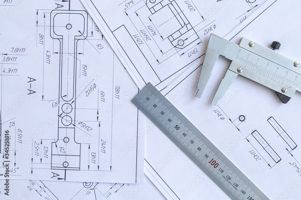 Top view of a caliper measuring tool, ruler and detail drawings.Engineering drawings, metal detail. Top view of a caliper measuring tool, ruler and detail drawings.Engineering drawings, metal detail.