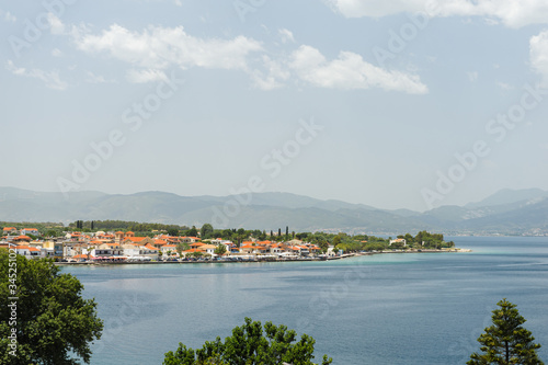 View of the Greek coast with houses, houses with red roofs,  Greece