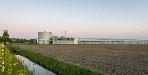 Modern complex of greenhouses and heating house in western part of The Netherlands