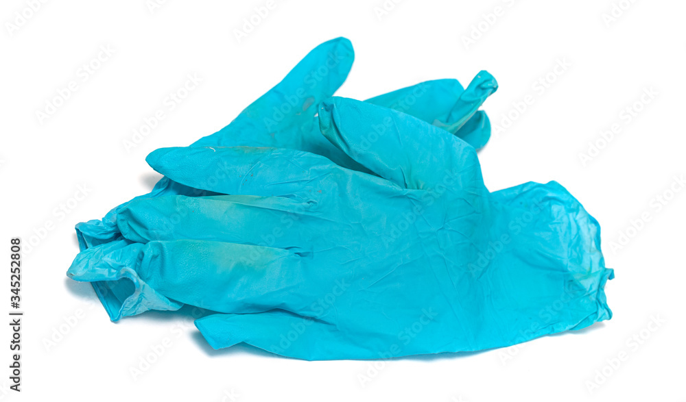 Used blue rubber gloves on a white background.