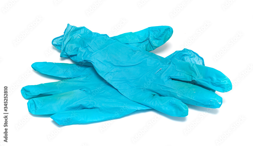 Used blue rubber gloves on a white background.