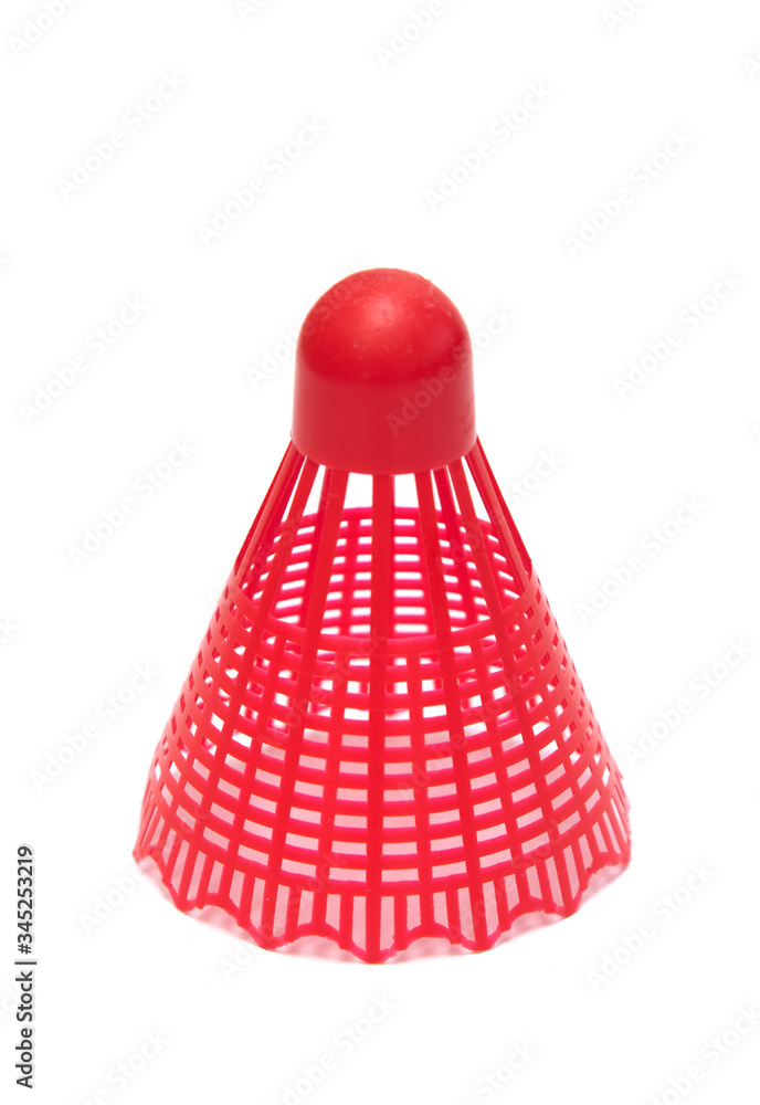 Red shuttlecock for playing badminton on a white background.