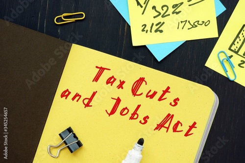 Conceptual photo about Tax Cuts and Jobs Act TCJA with written phrase.