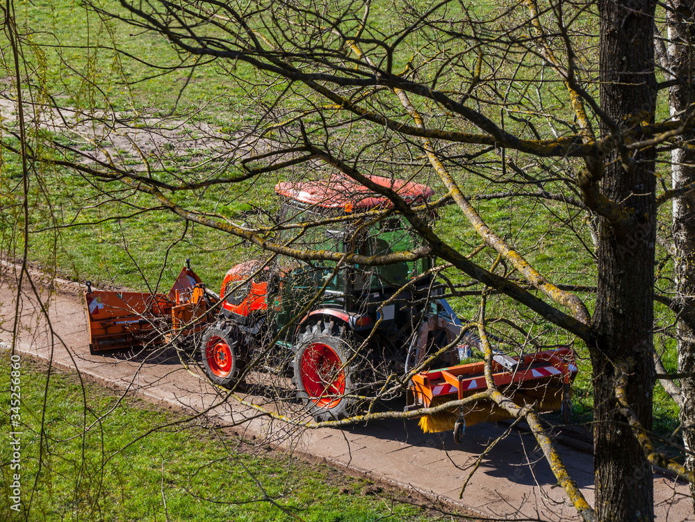 Red tractor maintains the footpaths