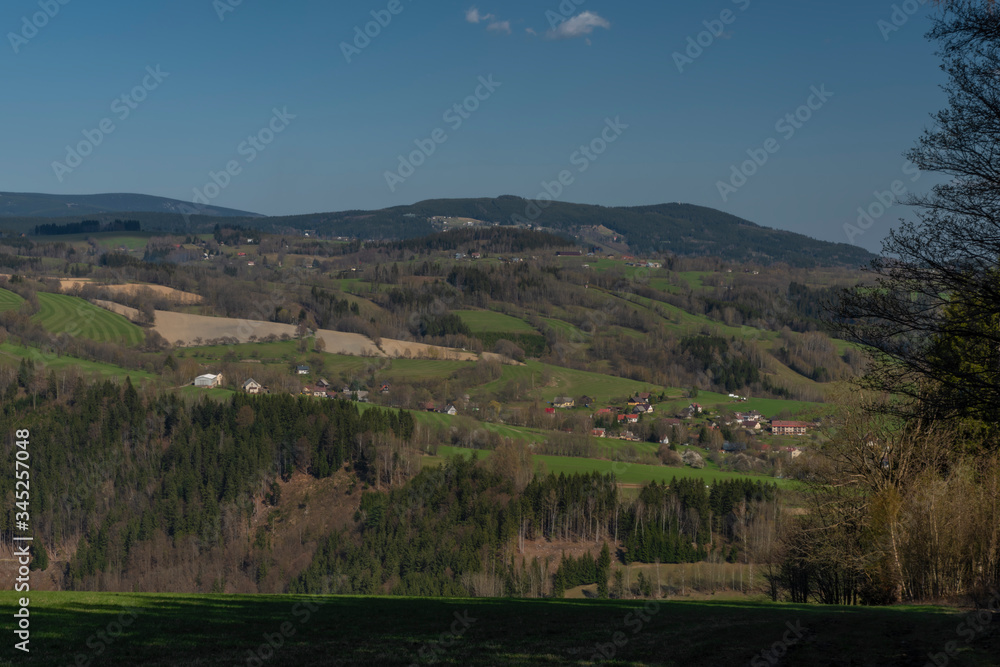 Naklejka premium Meadows near Krkonose mountains in spring nice day
