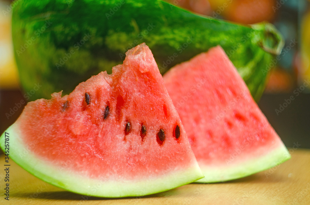 sliced ​​slices of sweet watermelon, background with slices of watermelon