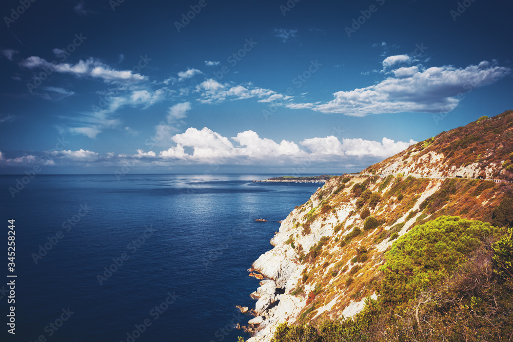 Slope with road along Mediterranean sea on island of Elba in classic clue color