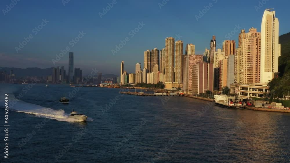 Motorboat pass out Victoria Harbour at dusk Motorboat pass out Victoria Harbour at dusk
