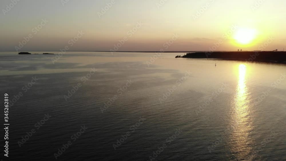 Stunning landscape of the sea and beach in the setting sun aerial footage from the air with a drone. Stunning landscape of the sea and beach in the setting sun aerial footage from the air with a drone.