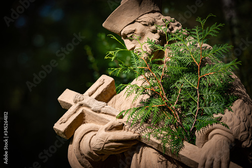 Statue of priest in city park of Bad Mergentheim photo