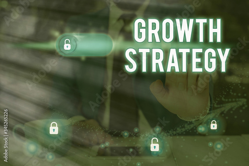 Writing note showing Growth Strategy. Business concept for Strategy aimed at winning larger market share in shortterm photo