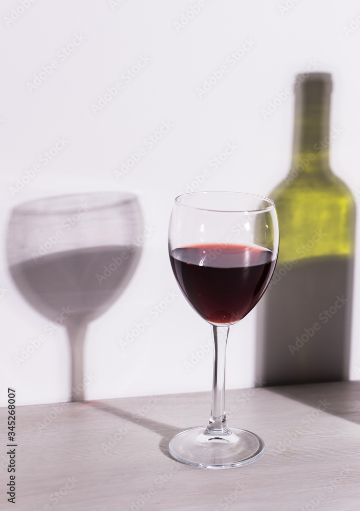 Shadow of wine glass in dark light. Shadow of wine glass in dark light.