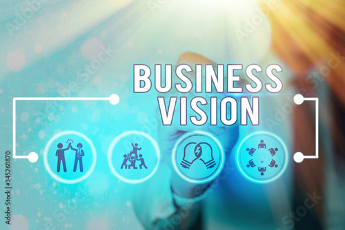 Writing note showing Business Vision. Business concept for grow your business in the future based on your goals photo